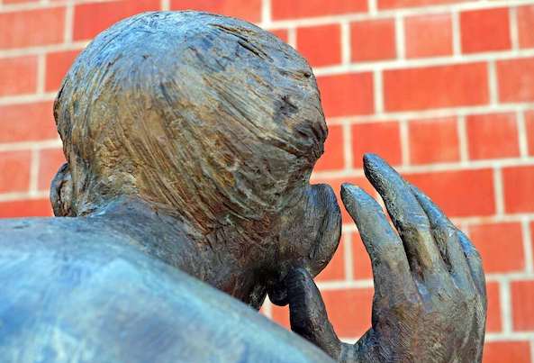 listen art artwork bronze college of music figure freiburg from the rear listen to man sculpture spy on swim the listening to listen